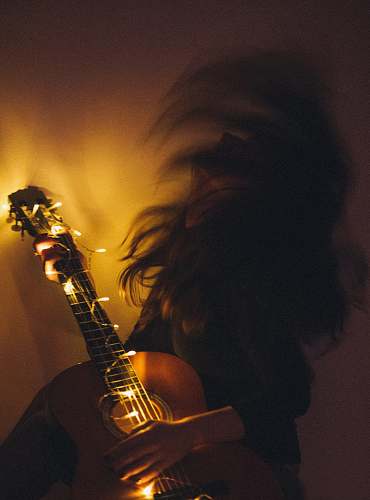 musical instrument woman playing guitar leisure activities